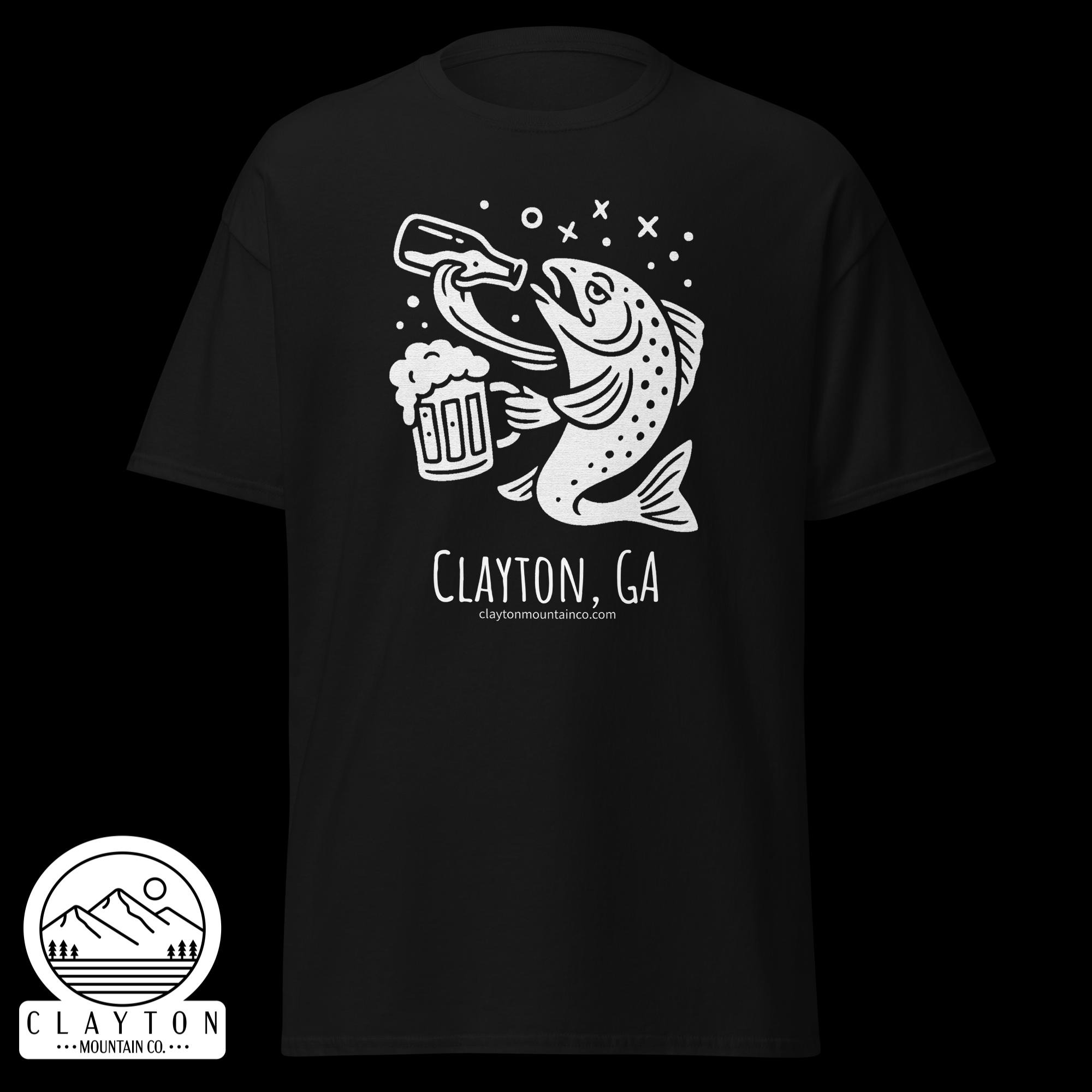 unisex-classic-tee-black-front-6a2e5d89939bejpg - Clayton Mountain Co. Black t-shirt featuring a white line drawing of a fish grabbing a beer mug with bubbles and mountains in a circular logo at the bottom reading Clayton Mountain Co., Clayton, GA