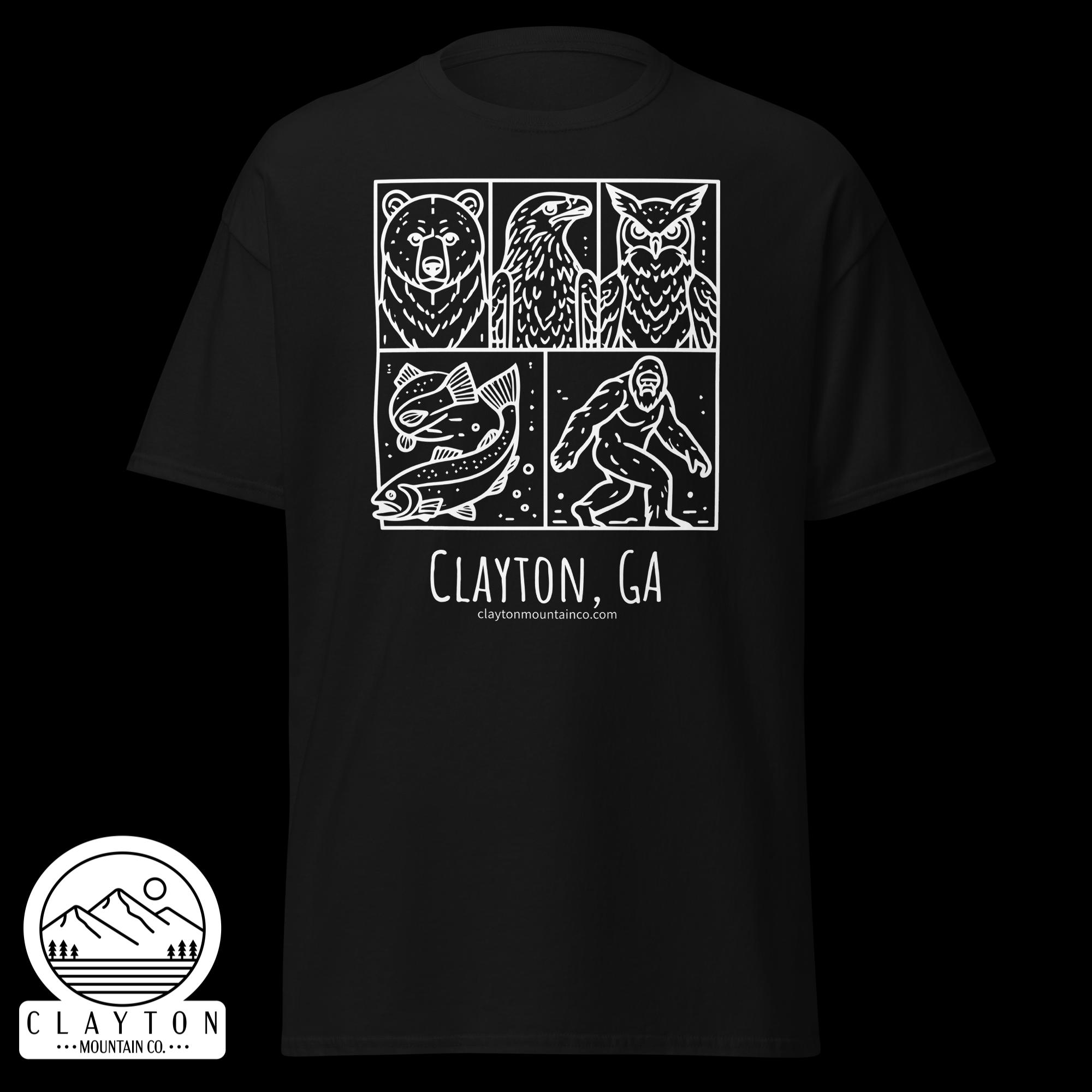 unisex-classic-tee-black-front-6a2e6635a3940jpg - Clayton Mountain Co. Black T-shirt featuring a white comic-style panel with bear, eagle, and owl illustrations; below reads Clayton, GA and a mountain logo site.
