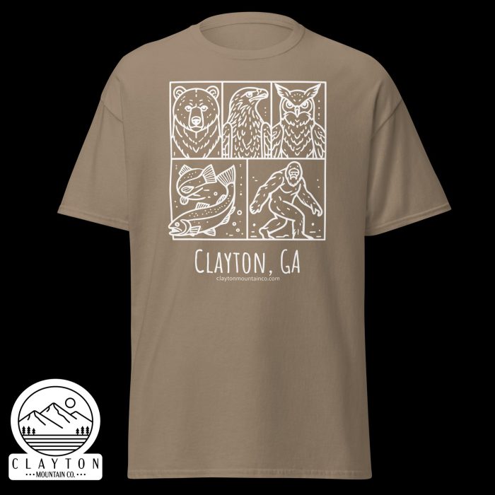 unisex-classic-tee-brown-savana-front-6a2e6635a143ajpg - Clayton Mountain Co. Beige T-shirt with a white four-panel graphic: bear, eagle, fish, and a humanoid figure; beneath reads Clayton, GA and a mountain logo.
