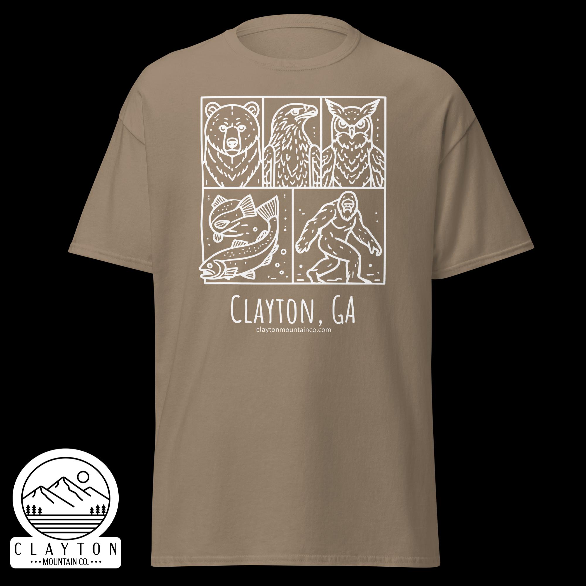 unisex-classic-tee-brown-savana-front-6a2e6635a143ajpg - Clayton Mountain Co. Beige T-shirt with a white four-panel graphic: bear, eagle, fish, and a humanoid figure; beneath reads Clayton, GA and a mountain logo.