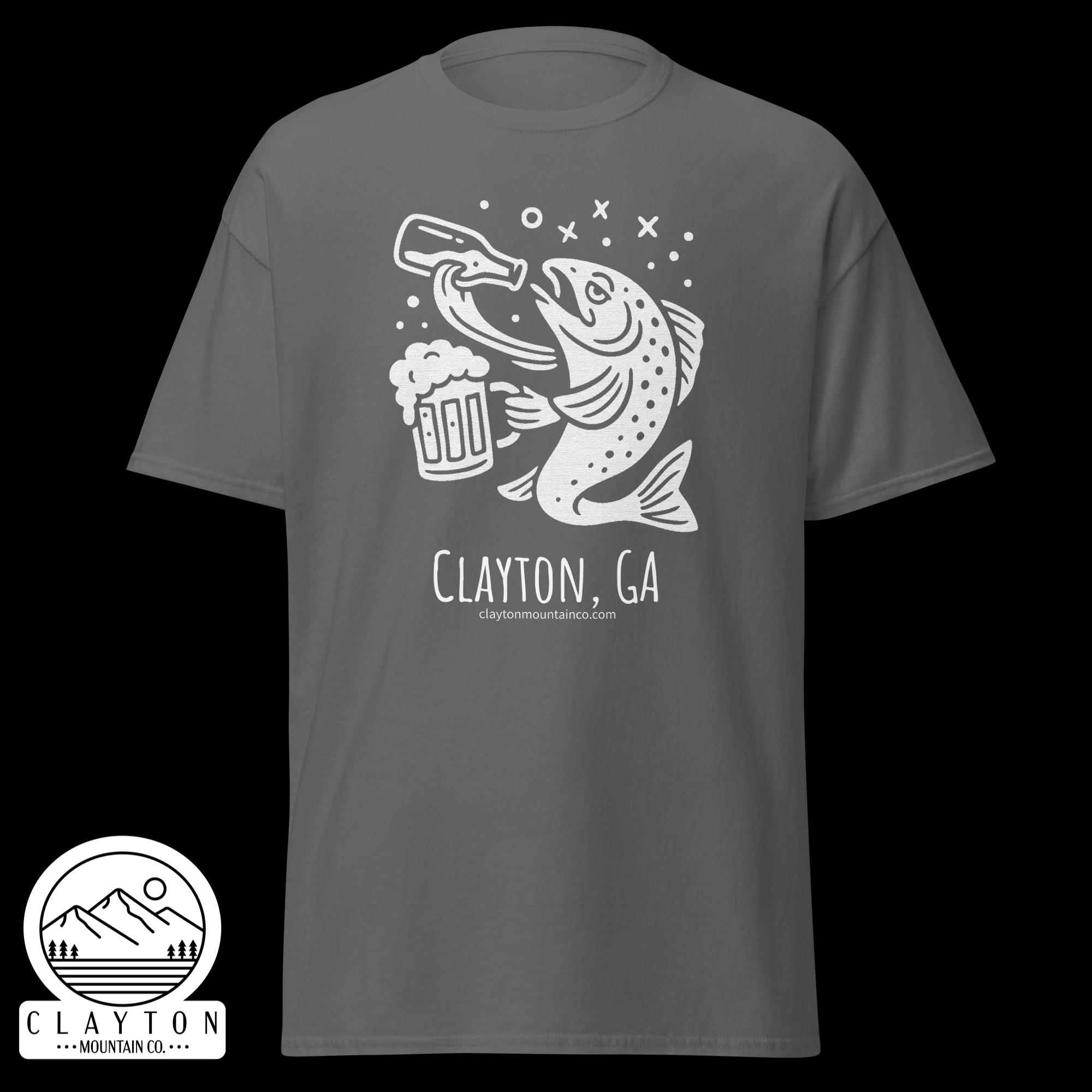 unisex-classic-tee-charcoal-front-6a2e5d899b41djpg - Clayton Mountain Co. Gray T-shirt with a white illustration of a fish grabbing a beer mug, plus Clayton Mountain Co. logo at the bottom left.