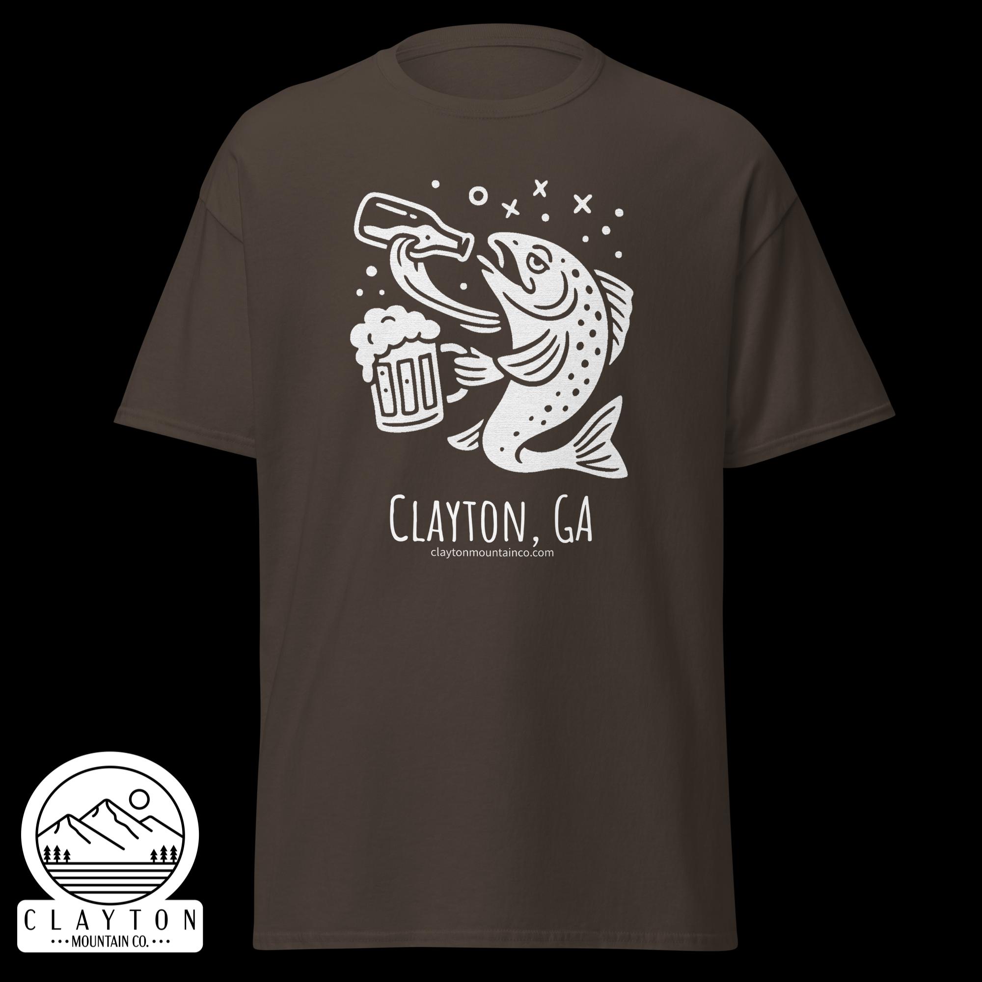 unisex-classic-tee-dark-chocolate-front-6a2e5d899d285jpg - Clayton Mountain Co. Brown T-shirt featuring a white line drawing of a trout holding a beer mug with bubbles, plus the text 'Clayton, GA' and the website 'claytonmountainco.com' underneath.