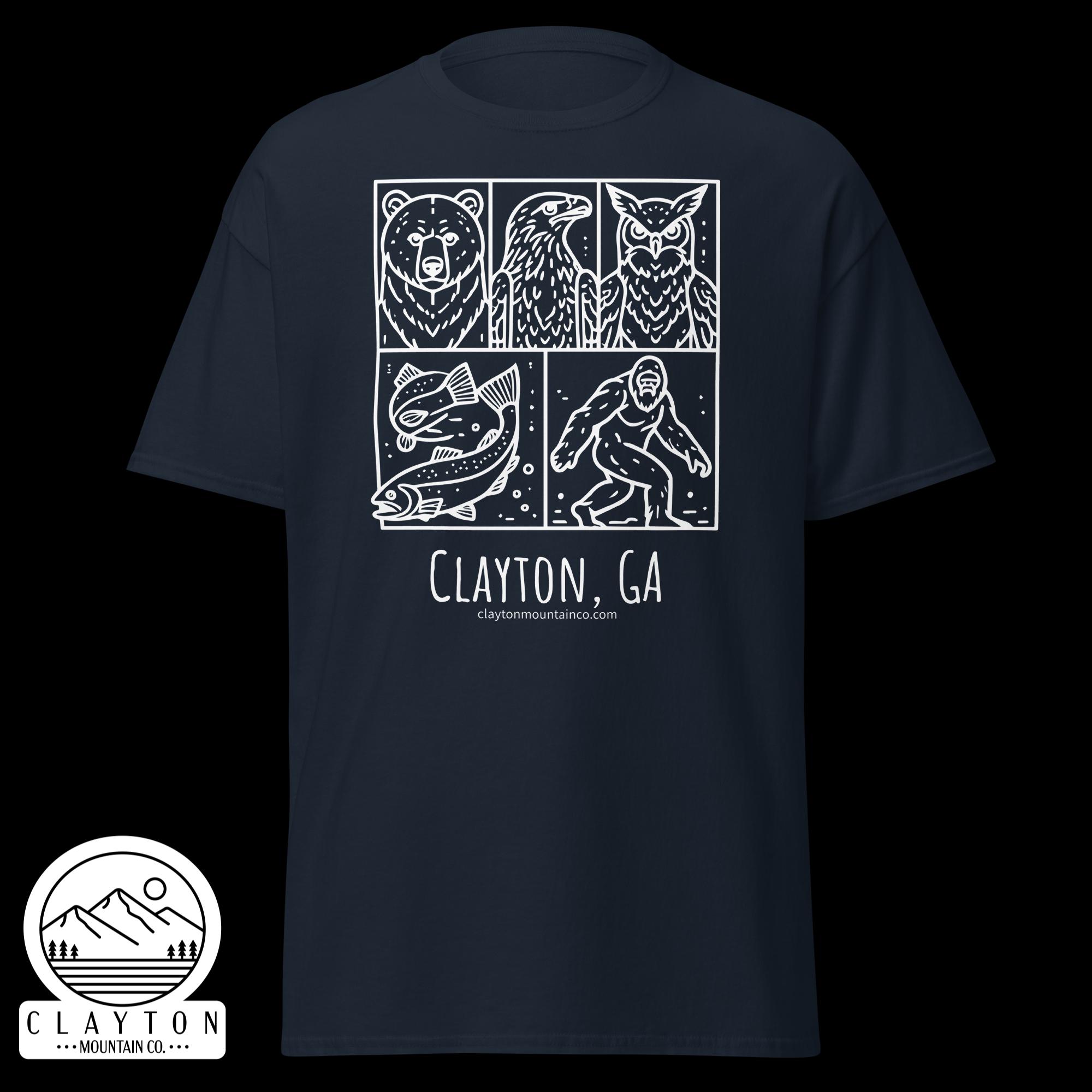 unisex-classic-tee-navy-front-6a2e6635af393jpg - Clayton Mountain Co. Navy T-shirt with a white comic-style panel showing bear, eagle, owl, a fish, and a climber, plus 'Clayton, GA' and the Clayton Mountain Co. logo.