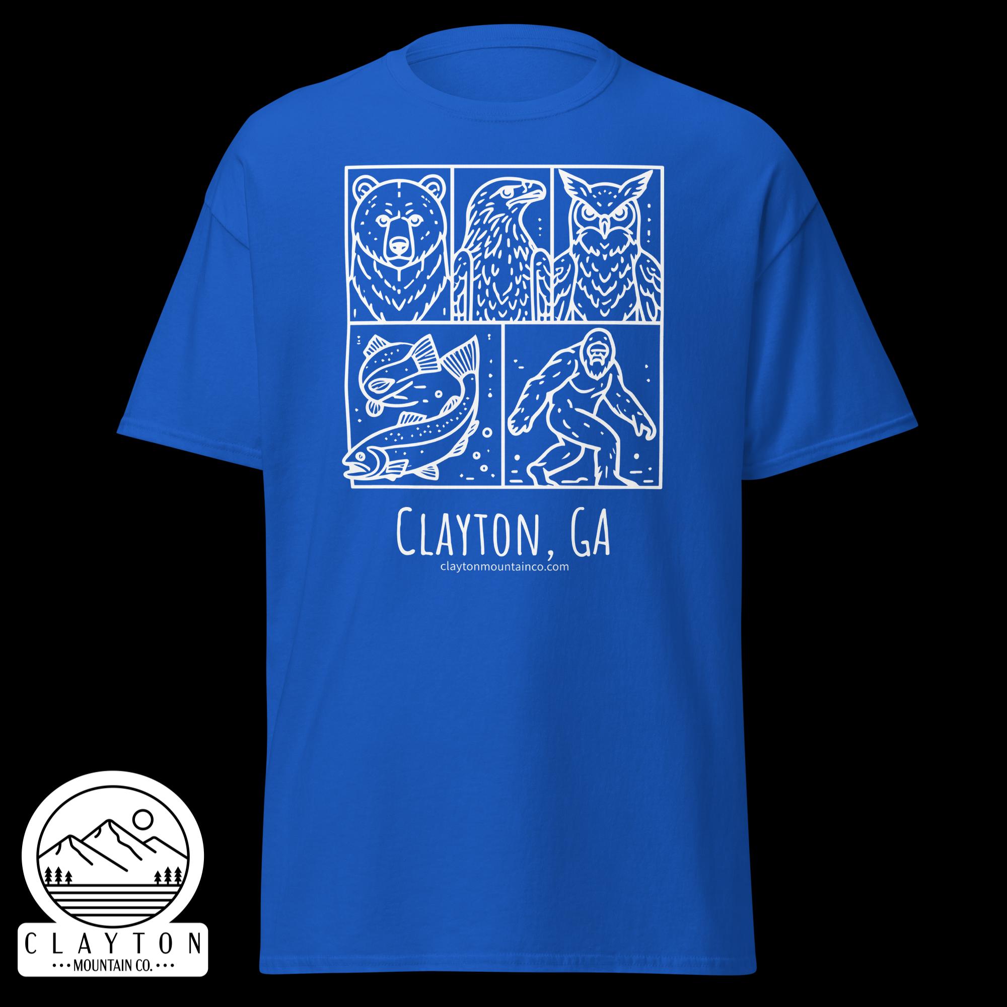 unisex-classic-tee-royal-front-6a2e6635b15efjpg - Clayton Mountain Co. Blue T-shirt showing a white, four-panel graphic of bear, eagle, fish and climber with Clayton, GA text at the bottom.